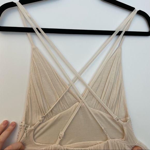 Free People Cream sparkly mini dress with a strappy back!
Size: 2 Never worn! - Picture 4 of 4